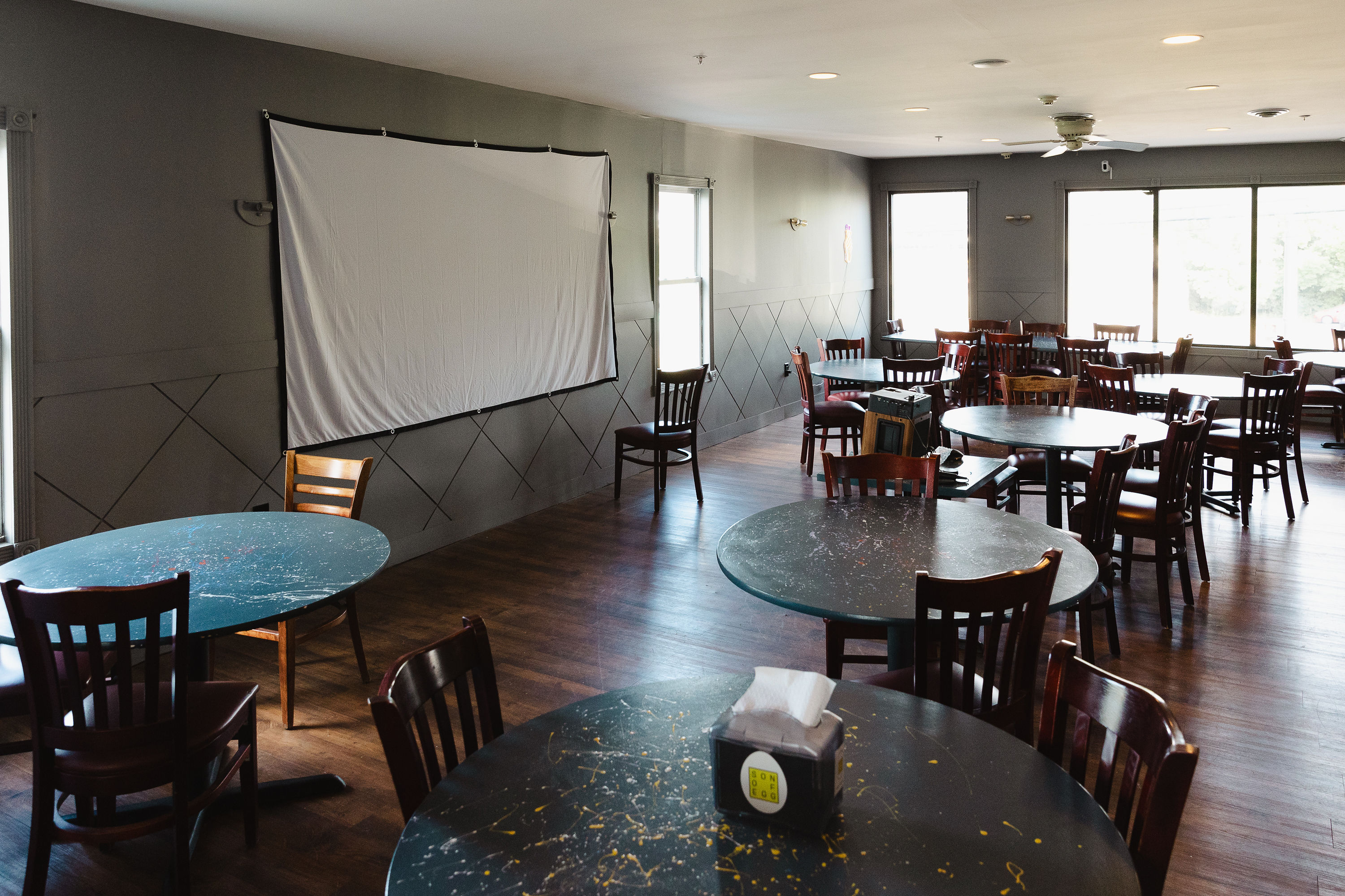 Big projector screen wall for slideshows and watch parties